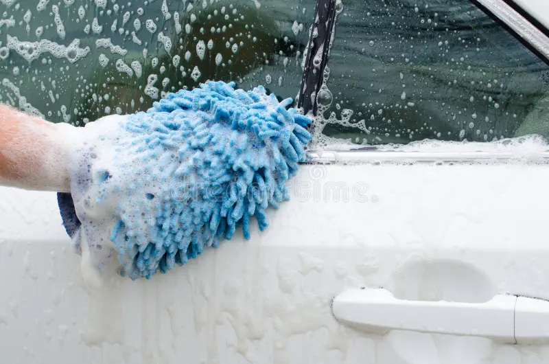 A car receiving a professional hand wash